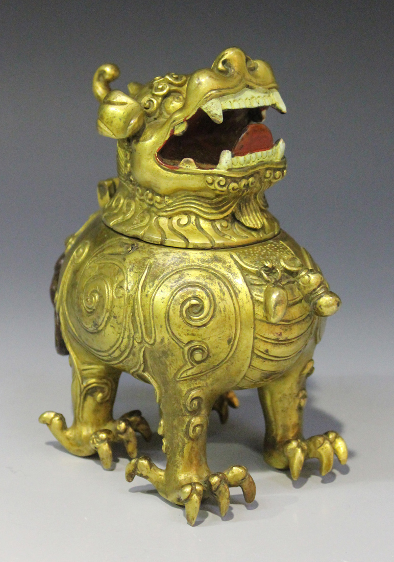 A Chinese cast gilt bronze incense burner in the form of a chimera, mark of Yongzheng but probably