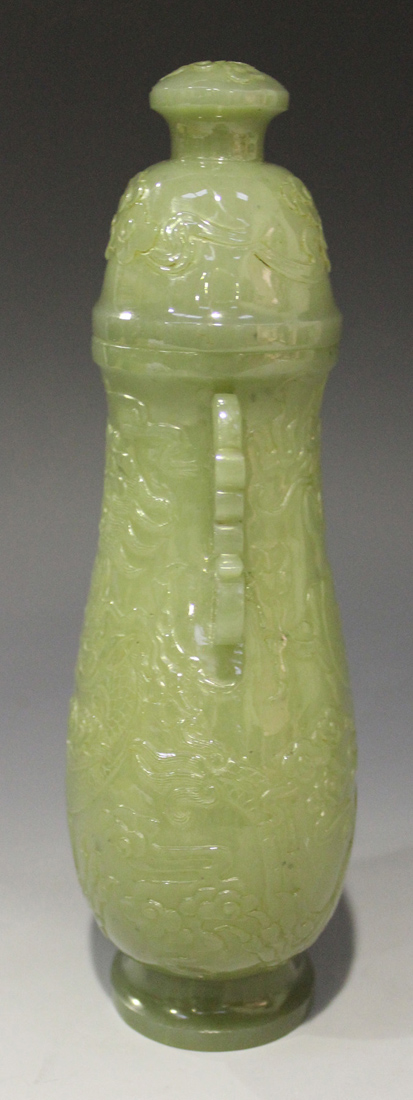 A Chinese celadon jade pear form vase and cover, late Qing dynasty, finely hollowed and carved in - Image 4 of 8