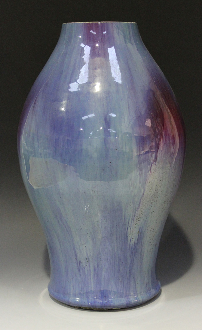 A Chinese flambé glazed porcelain vase, Qing dynasty, possibly 18th century, the baluster body