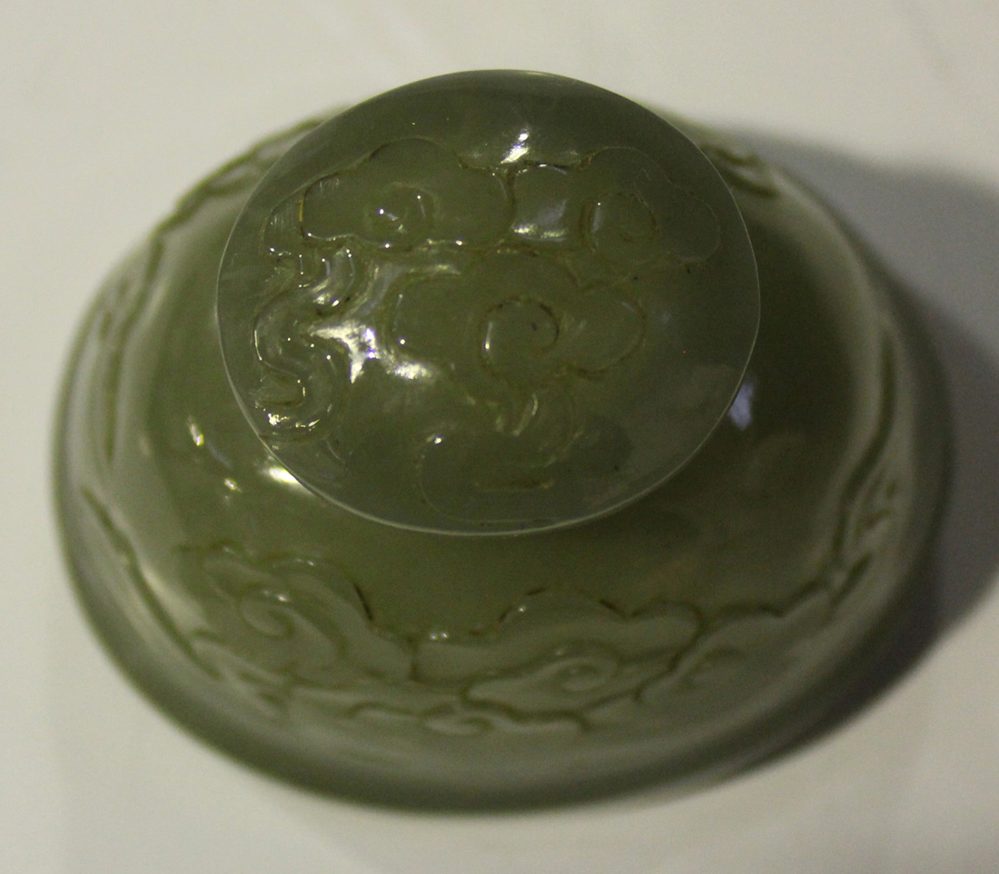 A Chinese celadon jade pear form vase and cover, late Qing dynasty, finely hollowed and carved in - Image 8 of 8