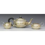 A George V silver three-piece tea set, each of squat circular form, comprising teapot, sugar bowl