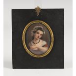 Continental School - Oval Miniature Portrait of a Lady holding a Tulip, enamels on porcelain, 7cm
