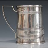 A George III silver tankard of tapering cylindrical form with banded decoration, London 1802 by John