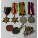 Four Second World War medals, comprising a 1939-45 Star, an Africa Star, a Defence Medal and a War