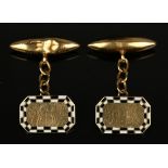 A pair of gold, black and white enamelled cufflinks, each cut cornered rectangular front with