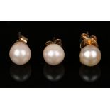 A pair of gold mounted cultured pearl earstuds and one odd gold mounted cultured pearl earstud, each