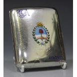 A George V silver and enamel cigarette case of curved rectangular form, the front decorated with the
