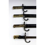 Three French model 1866 bayonets with sheaths, and a French model 1874 bayonet lacking sheath.
