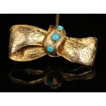 A Victorian gold and turquoise brooch, designed as a tied ribbon bow, mounted with three turquoise