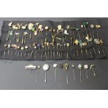 A collection of sixty-nine stick pins, including a few Victorian examples, one in black enamel,