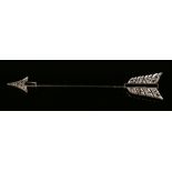 A diamond and black onyx jabot pin, designed as an arrow, the head and flights mounted with black