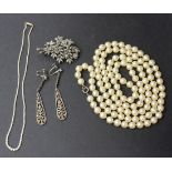 A single row necklace of graduated seed pearls, a single row necklace of imitation pearls, a