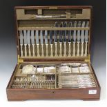 A mid-20th century plated canteen of cutlery, comprising eight table knives and forks, eight dessert