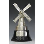 An Edward VIII silver model of a windmill with four rotating sails, on an ebonized circular base,