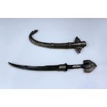 A late 19th century Middle Eastern jambiya with curved slender blade, length 24cm, palmwood and