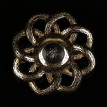 A Victorian piqué inlaid tortoiseshell brooch of circular flowerhead form, the centre decorated with