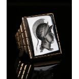 A gold ring, mounted with a rectangular haematite intaglio, carved as a classical portrait wearing a