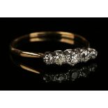 A gold, platinum and diamond five stone ring, mounted with a row of cushion shaped diamonds