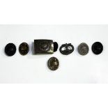 A Third Reich U-Boat Badge (lacking gilt finish), a Wehrmacht belt buckle and five Wound Badges,