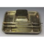 A George V silver inkstand of rectangular form, the rectangular inkwell with hinged lid and
