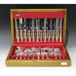 A plated canteen of King's pattern cutlery, comprising twelve table knives and forks, four serving