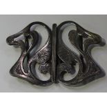 An Art Nouveau silver two-piece waist belt buckle of pierced scrolling form, Chester 1918, maker's