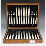 A set of twelve George V silver and mother-of-pearl dessert knives and forks, Sheffield 1928 by