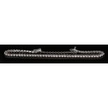 An 18ct white gold and diamond bracelet, mounted with a row of circular cut diamonds, on a snap