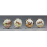 A set of four Edwardian silver menu holders, each upright glazed circular frame inset with a