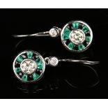 A pair of diamond, emerald and black onyx cluster earrings, each drop mounted with the principal
