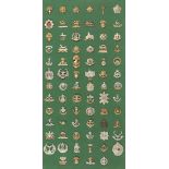 A collection of seventy-seven British Infantry cap badges, including some First World War
