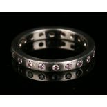 A platinum and natural pink diamond full eternity ring, mounted with twenty circular cut pink