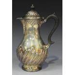 A late Victorian Scottish silver coffee pot of baluster form, with half spiral reeded decoration,