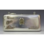A Finnish silver purse of oblong form, the front applied with gold monogram and four names, hinged