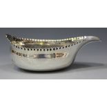 A George III silver pap boat with punch beaded rim, London 1784 by Hester Bateman, length 10.8cm.