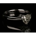 An 18ct white gold and diamond single stone ring, claw set with a heart shaped diamond, detailed '
