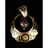 A Victorian piqué inlaid tortoiseshell pendant of circular crescent shaped design, decorated with