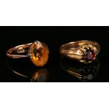 A 9ct gold ring, claw set with a circular cut garnet, ring size approx Q1/2, and a gold ring, claw