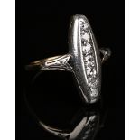 A diamond ring, mounted with a row of seven cushion shaped diamonds graduating in size to the