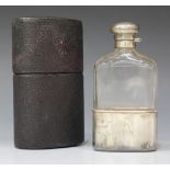 A late Victorian silver mounted and cut glass hip flask, with hinged lid and detachable cup,
