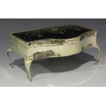 A George V silver and tortoiseshell trinket box of rectangular form with serpentine front, the