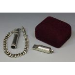 A late Victorian silver small whistle engraved with foliate decoration, London 1896 by Sampson