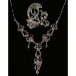 A silver and marcasite pendant necklace, the front decorated with pierced pendant drops, detailed '