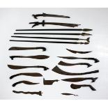 A collection of fourteen miniature Malayan and other edged weapons, including a kris, a pira and a