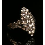 A Victorian diamond marquise shaped cluster ring, mounted with cushion shaped diamonds between