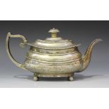 A George III silver teapot of cushion form with gadrooned rim, on ball feet, Exeter 1817 by Emmanuel