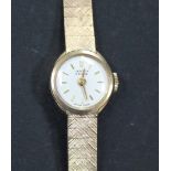 A Vertex Revue 9ct gold lady's bracelet wristwatch, the signed circular silvered dial with gilt