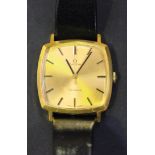 An Omega gilt metal fronted and steel backed curved square cased gentleman's wristwatch, the