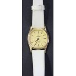 An Omega De Ville Quartz gilt metal fronted and steel backed wristwatch, the signed gilt dial with