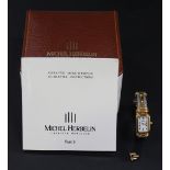 A Michel Herbelin, Paris, gilt metal and steel lady's bangle wristwatch, the signed rectangular dial